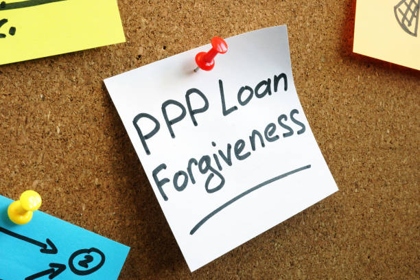 istock PPP loan forgiveness memo on the board. 1263863834
