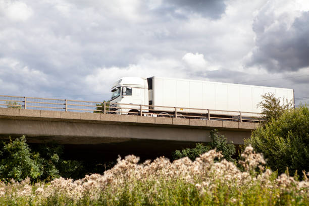istock White lorry on a bridge with a grey cloudy sky and copy space 1263863837
