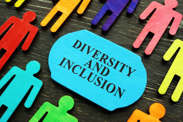Diversity and inclusion phrase and colored figurines. Diversity and inclusion phrase and colored wooden figurines. social inclusion photos stock pictures, royalty-free photos & images