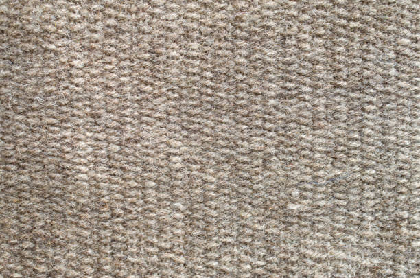 istock New woven brown woolen rug closeup 1263865096