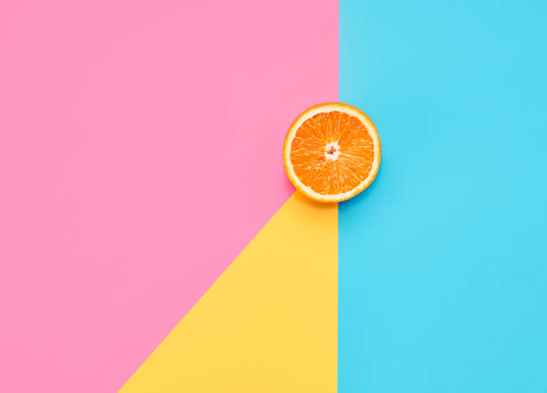 istock Orange on abstract geometry colored paper texture minimalism background 1263865219