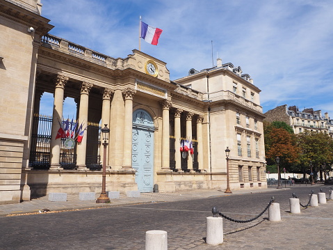 Paris, France - September 10, 2023 : Entrance of the Commercial Court building along the Seine river in Paris, France