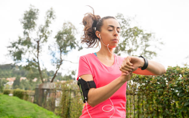 istock Woman tracking her progress on her smart watch while running outdoors 1263867082