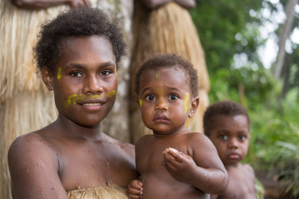 Indigenous mother with her child in her arms in Vanuatu Tanna, Republic of Vanuatu, July 12 2014: Indigenous mother with her child in her arms vanuatu stock pictures, royalty-free photos & images