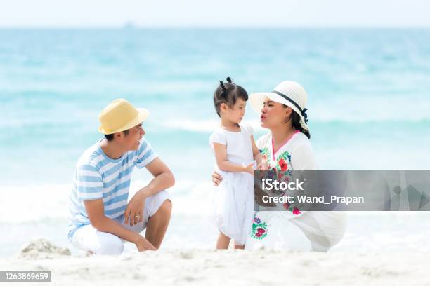 Happy Family Summer Sea  Beach Vacation Asia Young people Lifestyle Travel Enjoy Fun And Relax In Holiday Travel And Family Concept Stock Photo - Download Image Now