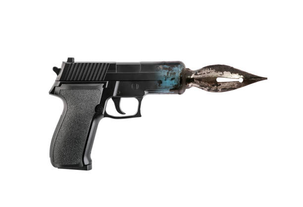 Pistol gun with old pen isolated on white background