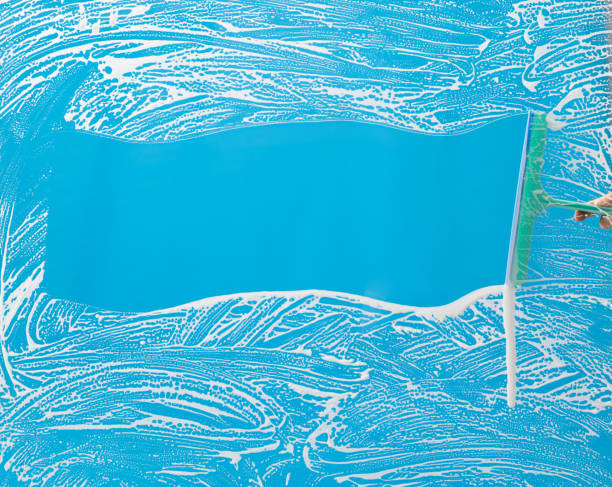 istock Cleaning glass window with squeegee 1263873638