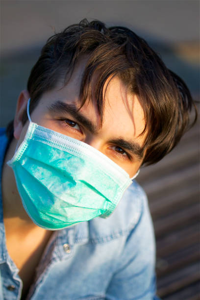 istock Young man in a face mask 1263873848