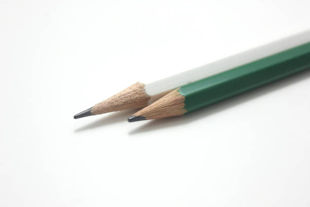 istock Green and white pencils isolated on white background. 1263873915