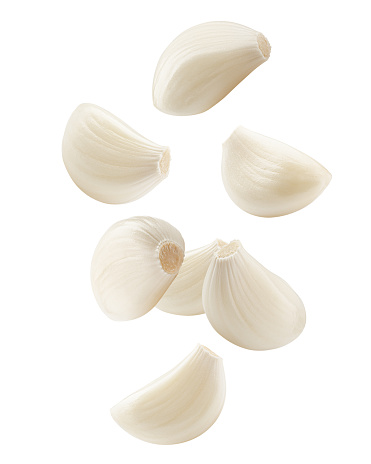 Falling garlic, isolated on white background, clipping path, full depth of field