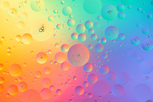 Abstract colorful macro background of oil bubbles on water rainbow wallpaper