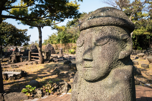 Jeju Island is famous for its iconic dol hareubang statues. The statues were first created in the mid 18th century to protect against demons and were often placed outside of city gates. They are usually made from porous volcanic rock and have come to symbolize the island which is a popular tourist destination in South Korea.