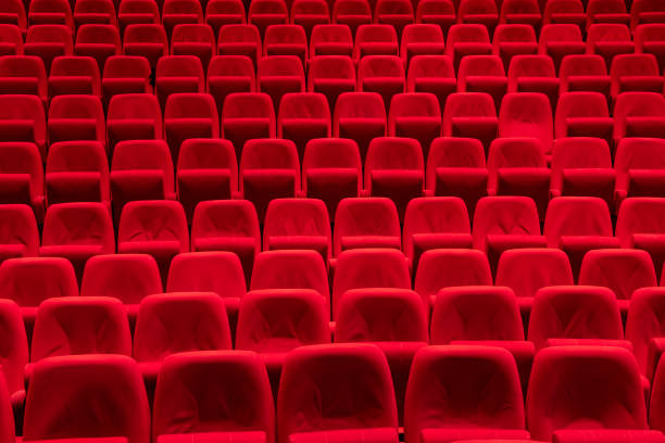 Red seats in theather Cinema theater with Red Seats.
Red and empty theater seats in a row theather stock pictures, royalty-free photos & images