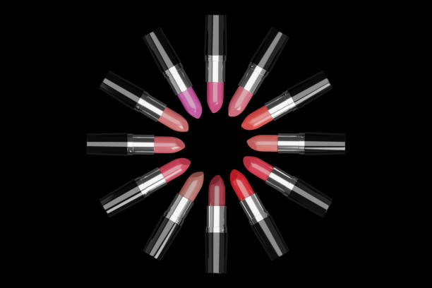 istock Lipsticks of different colors arranged in a circle on black background. 1263877864