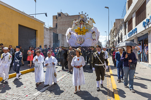 Arequipa, Peru - september 24, 2018: Religious parade of the citizens of Arequipa in traditional dress\n near the main square Plaza de Armas in Arequipa, Peru