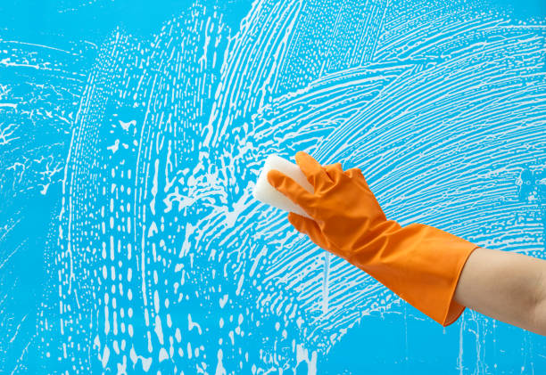 istock Cleaning glass window with sponge 1263877958