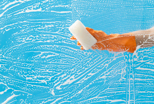 istock Cleaning glass window with sponge 1263878111
