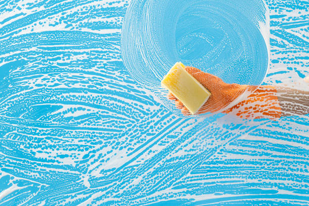 istock Cleaning glass window with sponge 1263878122