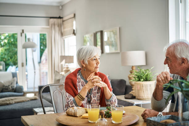 istock Senior woman talking with her husband during breakfast 1263879124