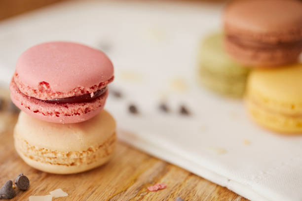 istock Sweet macarons on wooden table 1263879181