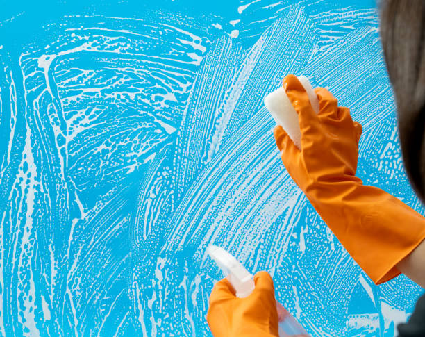 istock Cleaning glass window with sponge and spray bottle 1263880326