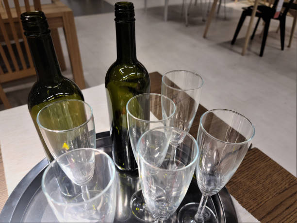 istock wine bottles and wine glasses on the shelf 1263881715