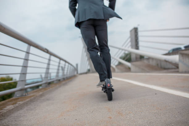 istock Man on electric push scooter 1263883865