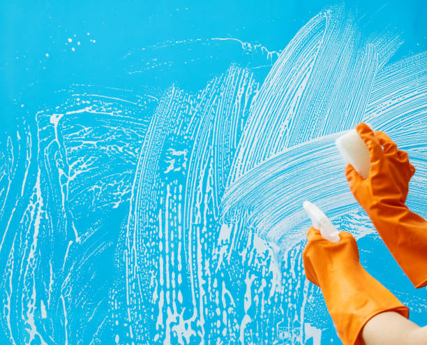 istock Cleaning glass window with sponge and spray bottle 1263884220