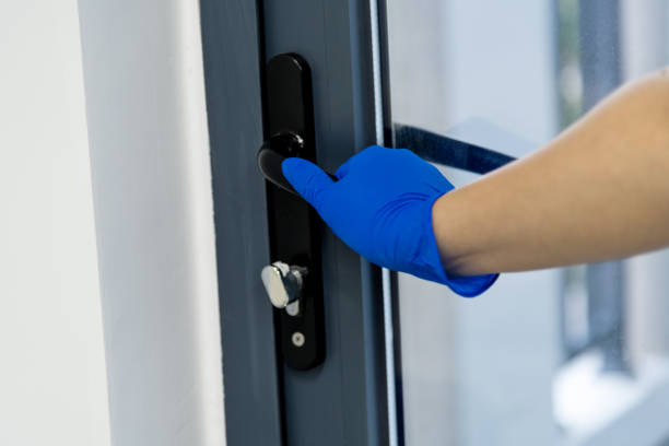 istock Open the door with protective glove 1263884580
