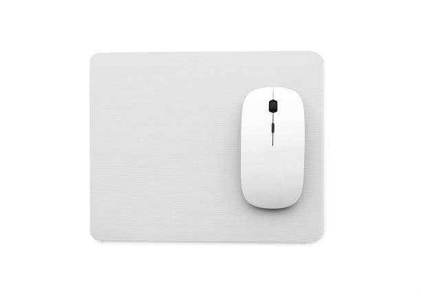 white computer mouse White wireless mouse on a mouse pad isolated on a white background, top view scrolling photos stock pictures, royalty-free photos & images