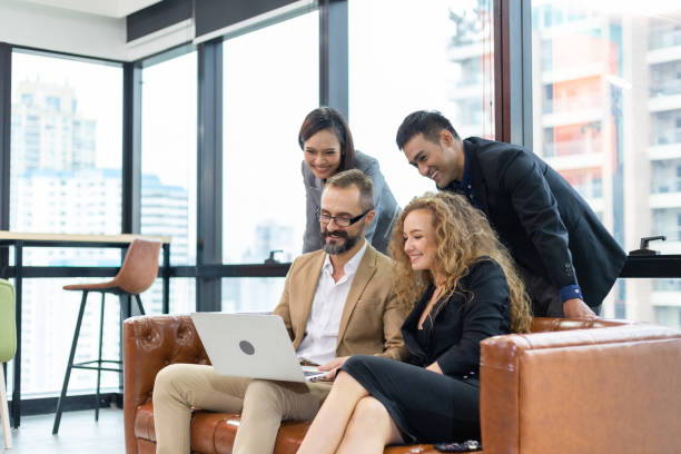 istock Group of diversity business people watching project on computer and brainstorming in modern office. Corporate team video conference meeting with customer. man and woman working together. copy space 1263888073