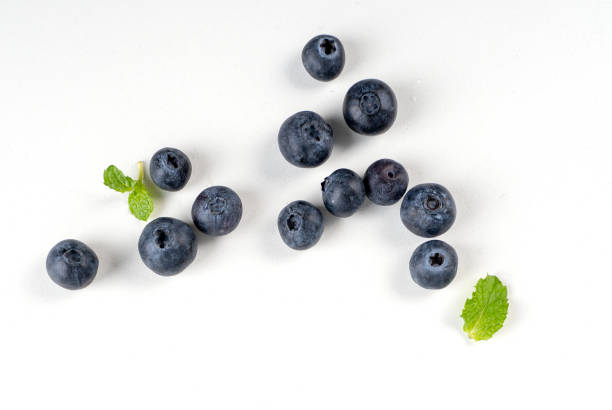 istock Blueberry fruit top view isolated on a white background, flat lay overhead layout with mint leaf, healthy design concept. 1263889919