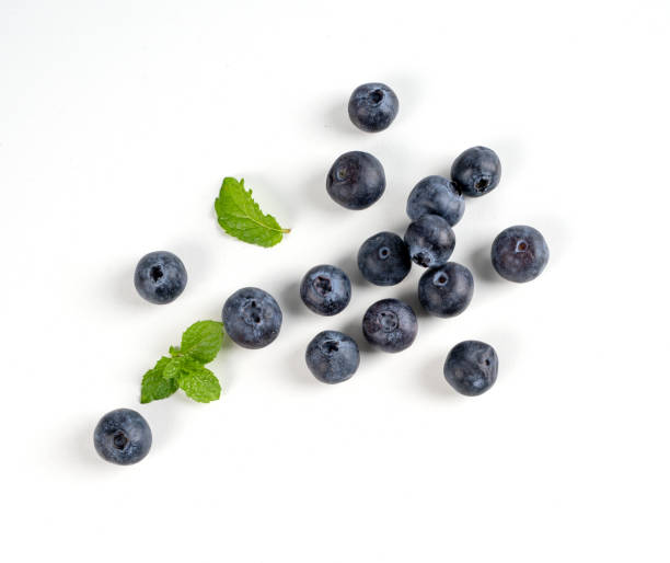 istock Blueberry fruit top view isolated on a white background, flat lay overhead layout with mint leaf, healthy design concept. 1263889931