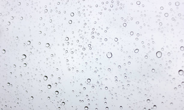 istock Water​ rain​ drops​ on​ glass​ background.​ Rain​ drops​ on​ a​ Windows. 1263890453