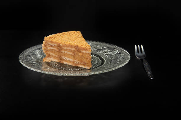 istock peanut pie on a plate on black table with black background, selective focus 1263891427