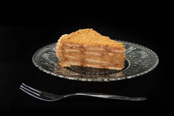 istock peanut pie on a plate on black table with black background, selective focus 1263891461