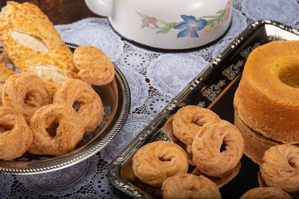 istock Breakfast table with cookies, breads and accessories on lace tablecloth and rustic wood, selective focus 1263891631