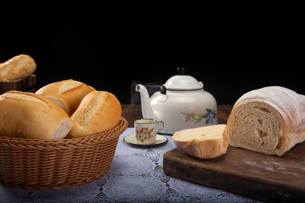 istock Breakfast table with cookies, breads and accessories on lace tablecloth and rustic wood, selective focus 1263891755