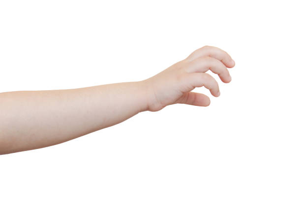 Small gold bracelet on wrist of thai fat baby children girl in Nonthaburi, Thailand.
