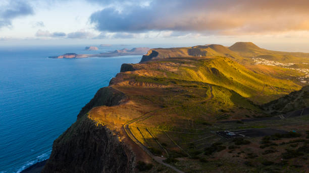 istock Sunlight over agricultural fields next to seashore, Lanzarote, Canary Islands, Spain 1263893032