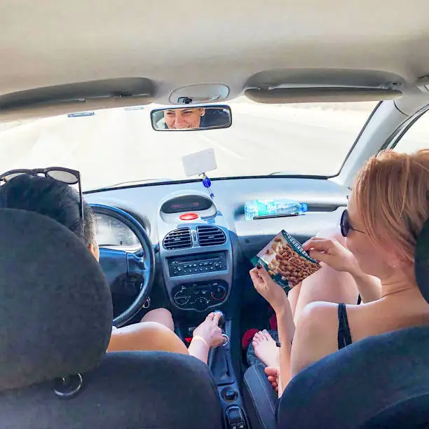 Photo of Girls traveling together with a car