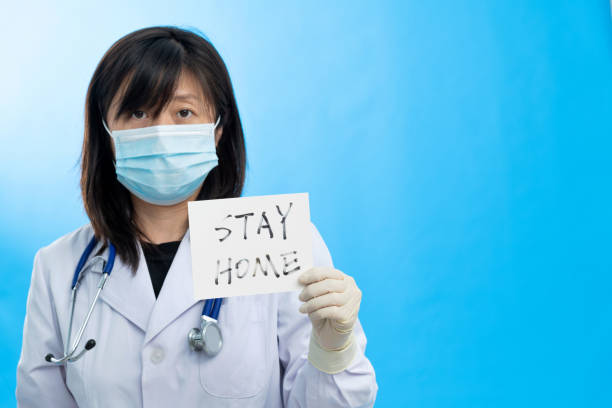 istock Doctor holding a paper that says stay 1263893434