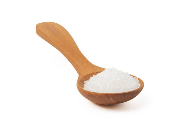 istock White sugar in wooden spoon isolated on white background 1263895025
