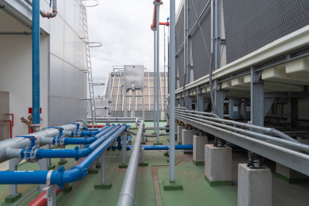 istock Chiller tower or cooling tower on rooftop of a office building. System work. Architecture machine. Condenser Water Supply (CDS) and Condenser Water Return (CDR) pipe lines. Ventilation compressor. 1263895034