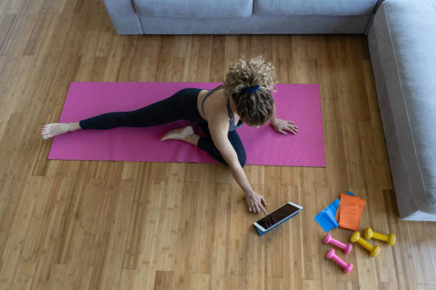 istock Woman training at home following an online class 1263897889