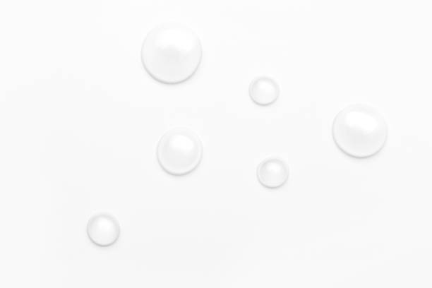 istock drops of water on a white background, top view. minimalism. purity 1263899109
