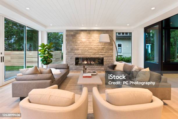 Mid Century Modern Style In Family Room Surrounded By Windows Stock Photo - Download Image Now