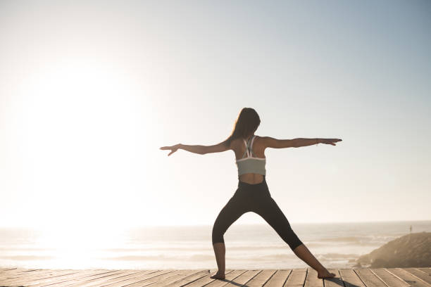 istock Women doing pilates on the beach 1263901776