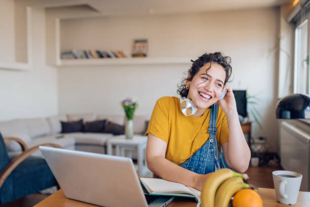 istock Young freelancing from home and enjoying music 1263901871