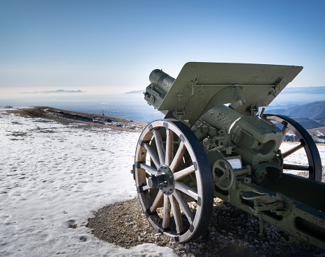 Old cannon surrounded by snow at Royal Battery in Quebec city during winter day